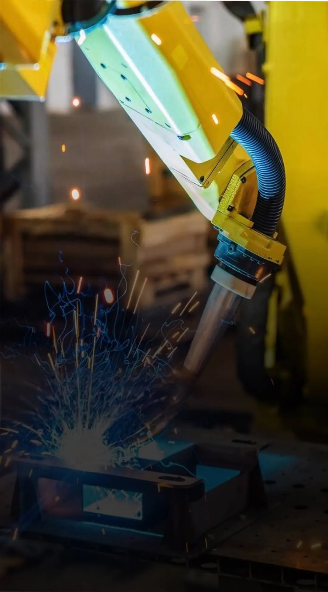 Industrial robotic automation solution featuring a welding robot in a smart factory environment.