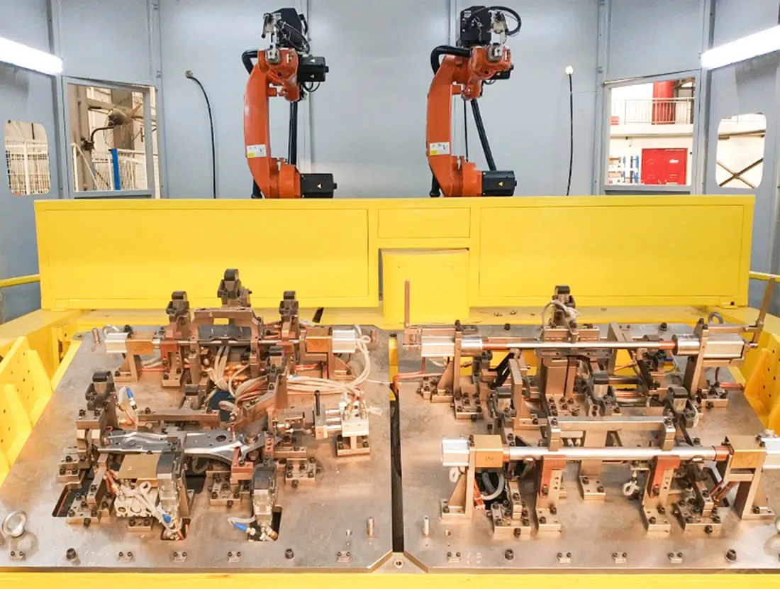 Multi axis robotic positioners and fixtures configured for flexible automated production