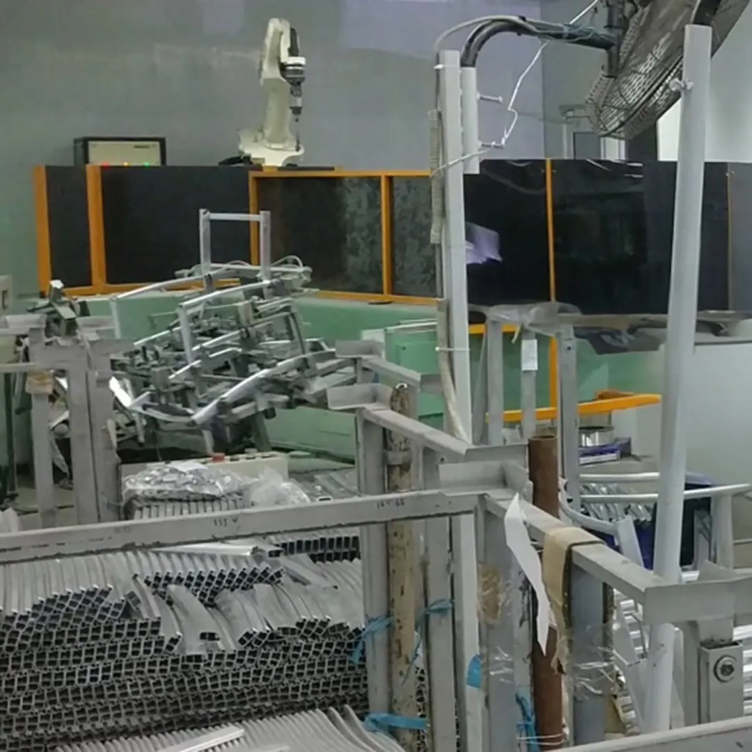Compact robotic welding cells for high volume metal furniture production