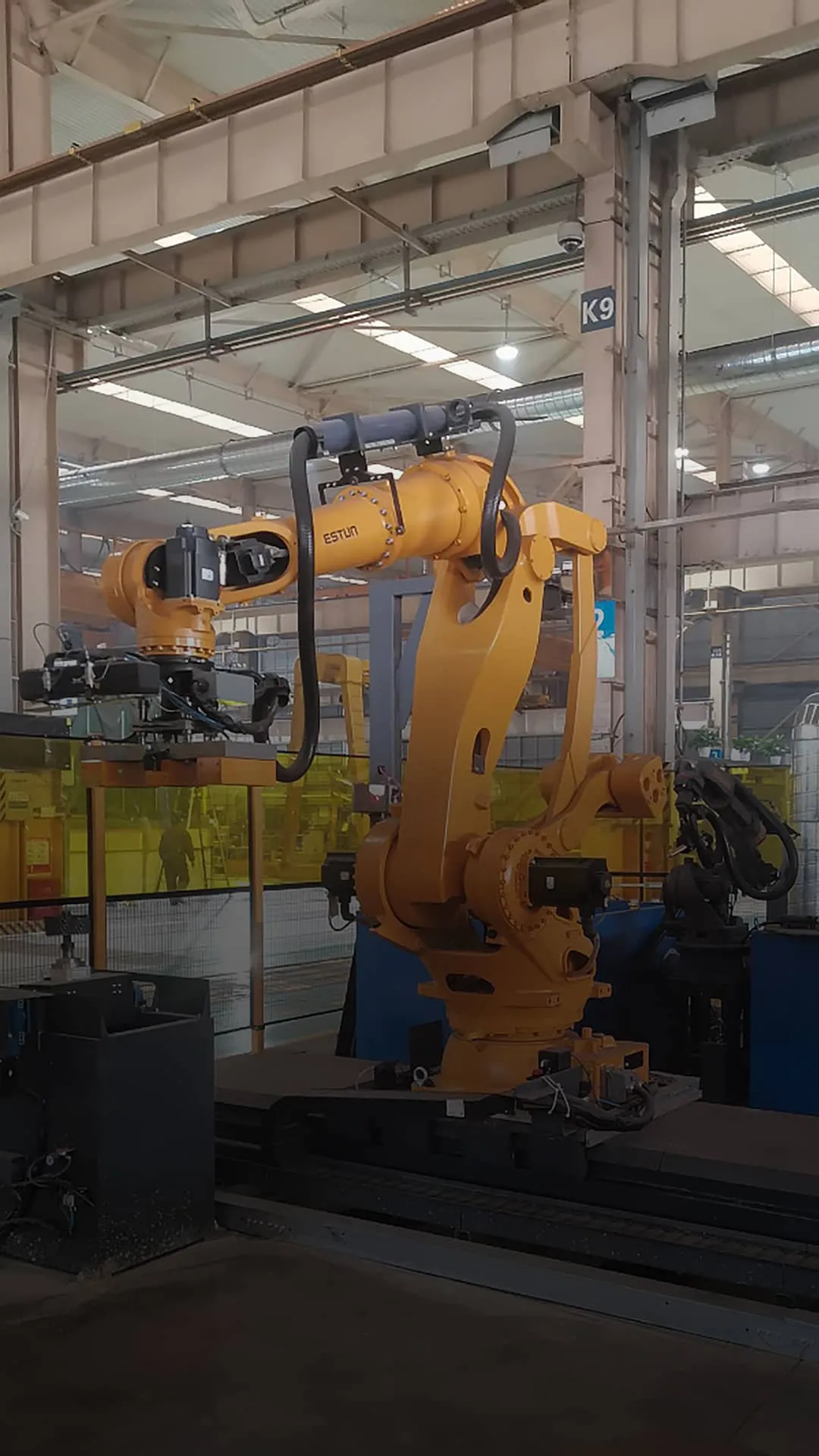 Industrial robot arms integrated into customized robotic automation systems